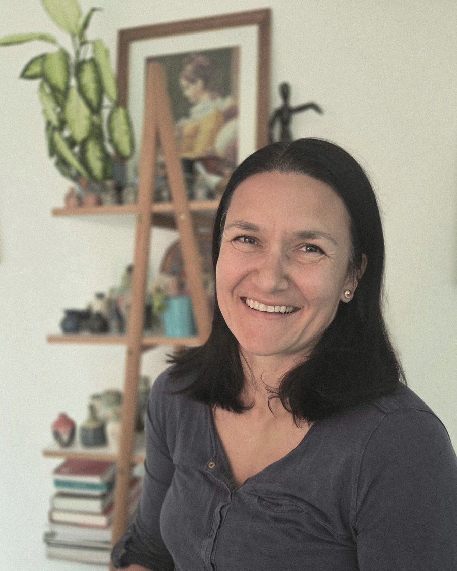 Ivana at home, with pieces from her workshop on the shelf behind her